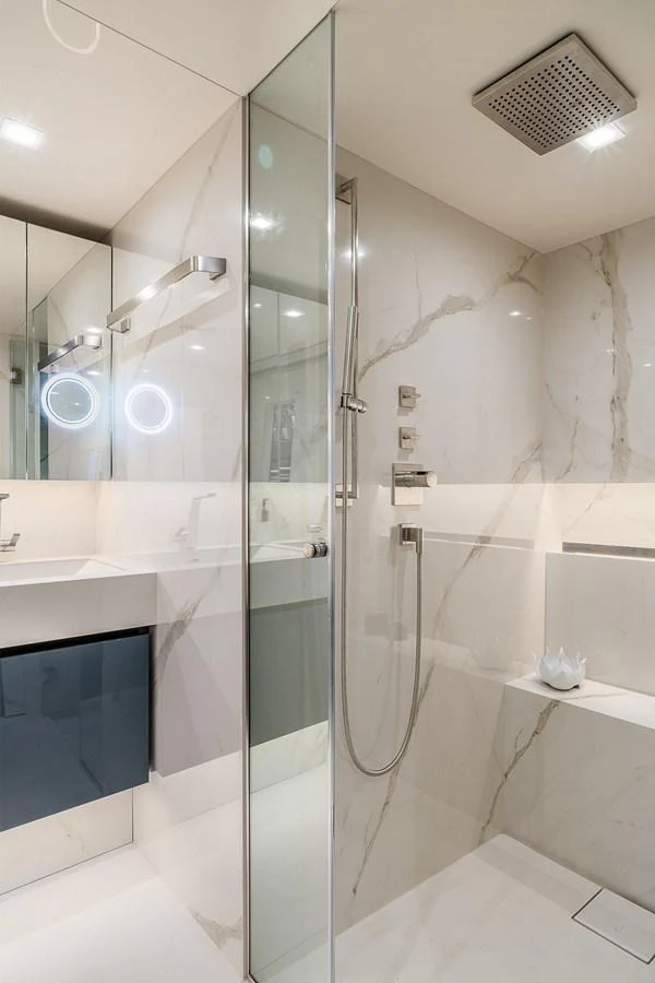 The yacht's bathroom features a sleek, modern design with luxurious fixtures and finishes. aboard SUNREEF 80 NEXT Yacht for Sale