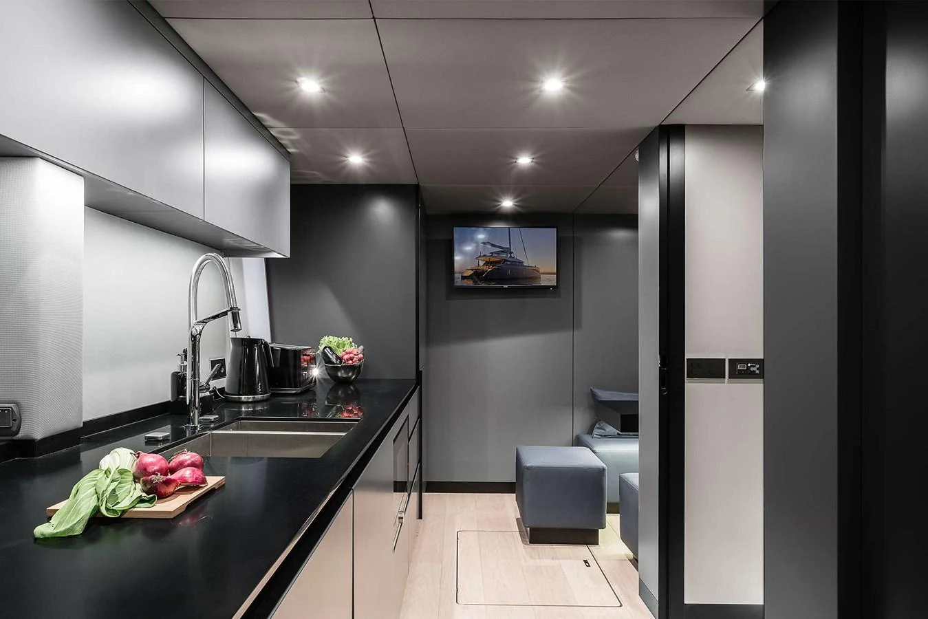 The sleek and modern galley features high-end appliances and ample counter space. aboard SUNREEF 80 NEXT Yacht for Sale
