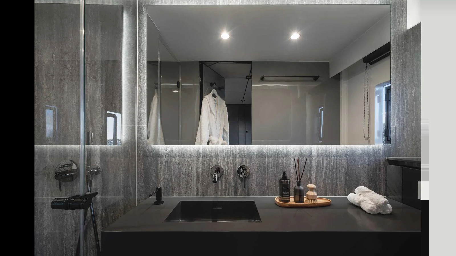 A sleek and modern yacht bathroom with luxurious amenities and elegant design. aboard 70 SUNREEF POWER NEXT Yacht for Sale