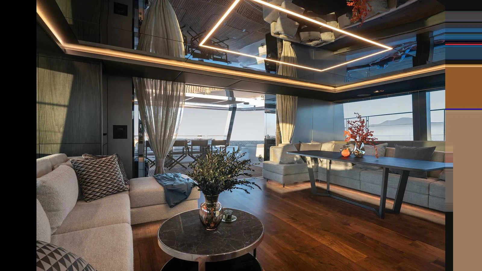 The yacht's interior features a luxurious and modern living area with elegant furnishings and a stunning view. aboard 70 SUNREEF POWER NEXT Yacht for Sale