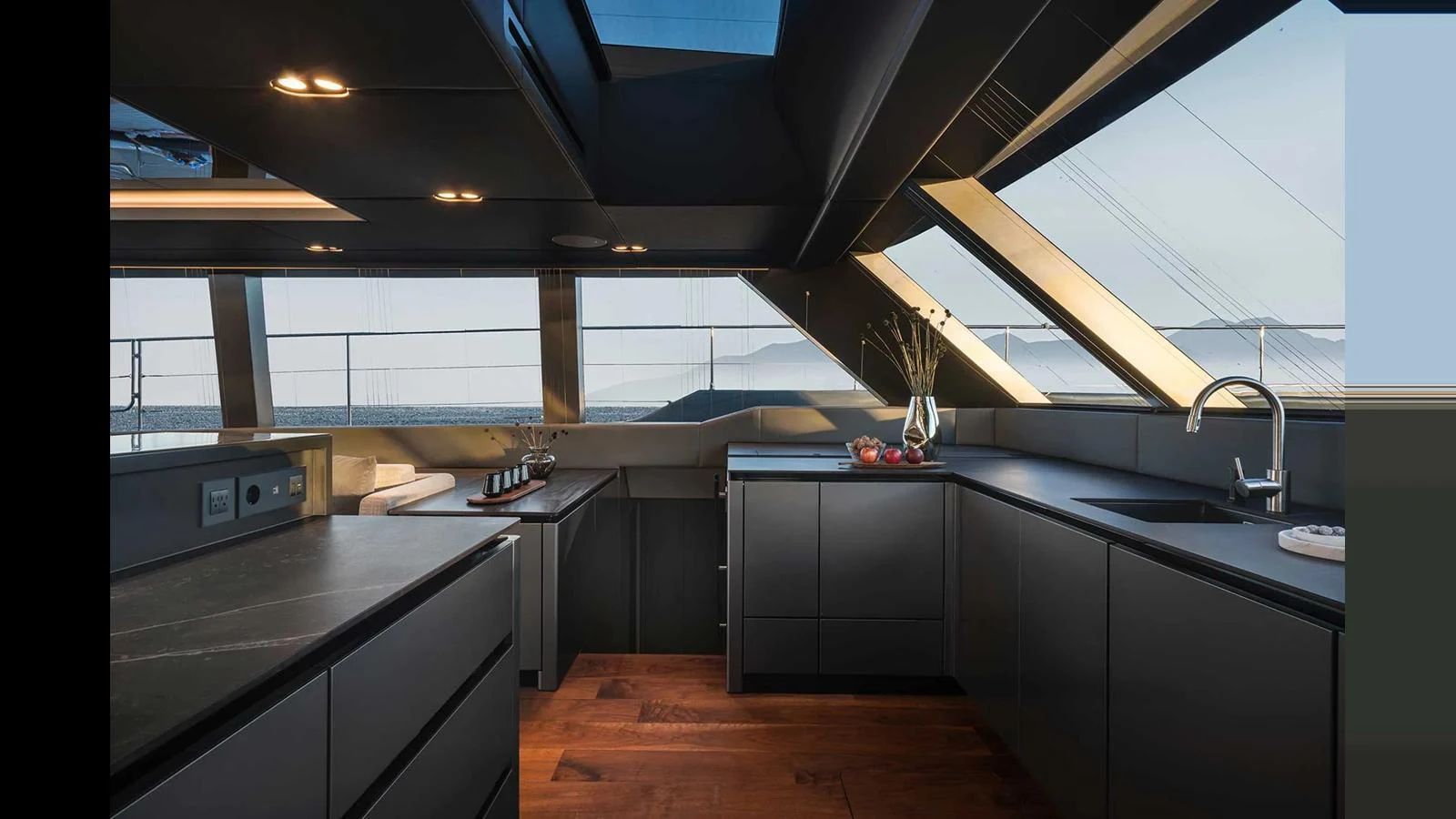 A sleek and modern galley with panoramic windows offering stunning sea views. aboard 70 SUNREEF POWER NEXT Yacht for Sale