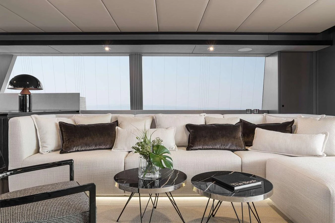 The salon features a luxurious seating area with plush cushions and elegant decor. aboard SUNREEF 70 NEXT Yacht for Sale