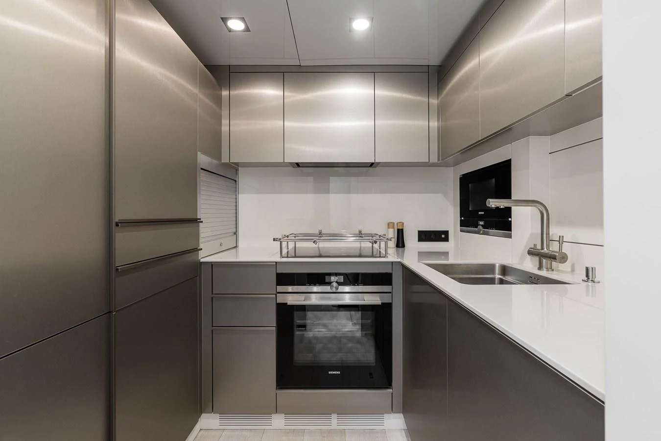 The sleek and modern galley features stainless steel appliances and ample storage space. aboard SUNREEF 70 NEXT Yacht for Sale