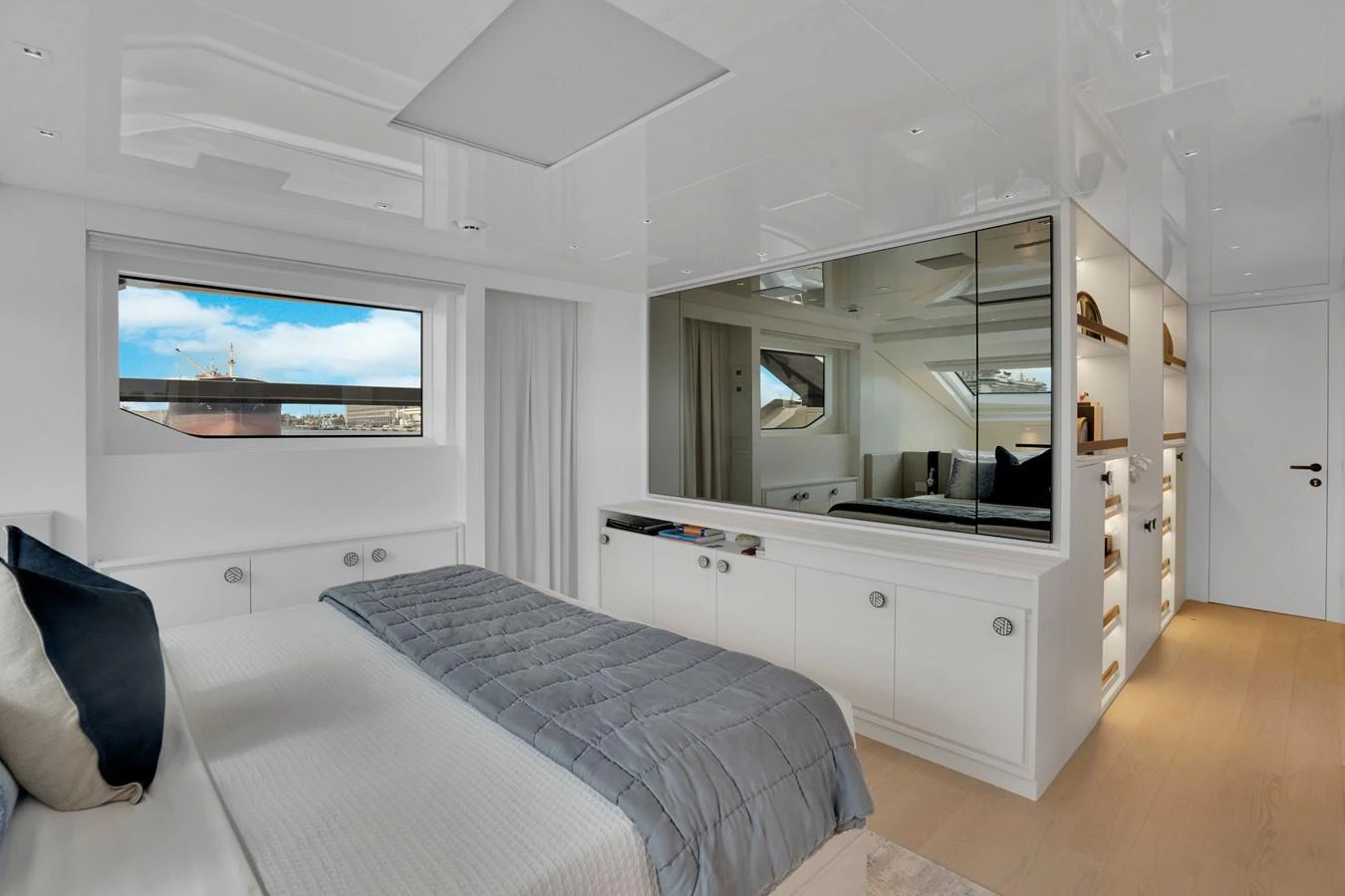 a bedroom with a bed and a tv on the wall aboard SWEET VIRGINIA Yacht for Sale