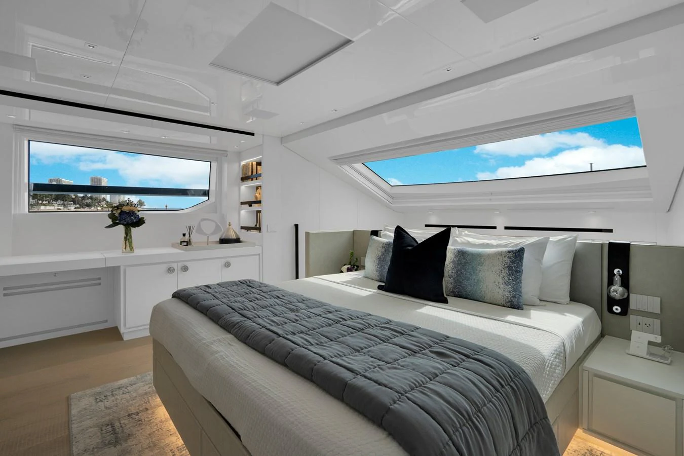 a bed with a white bed spread aboard SWEET VIRGINIA Yacht for Sale