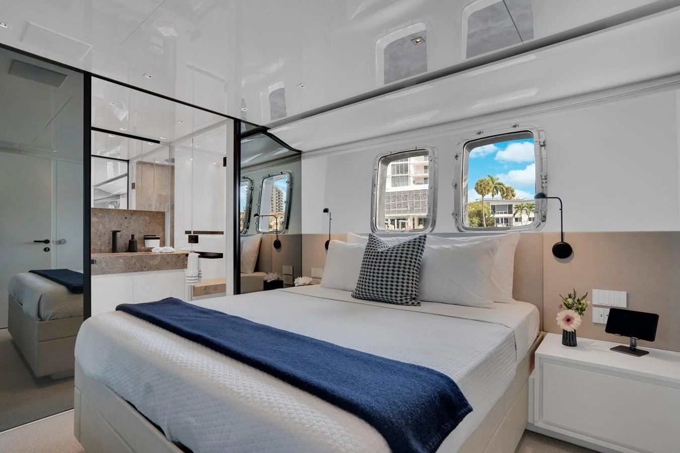 a bedroom with a large mirror aboard SWEET VIRGINIA Yacht for Sale