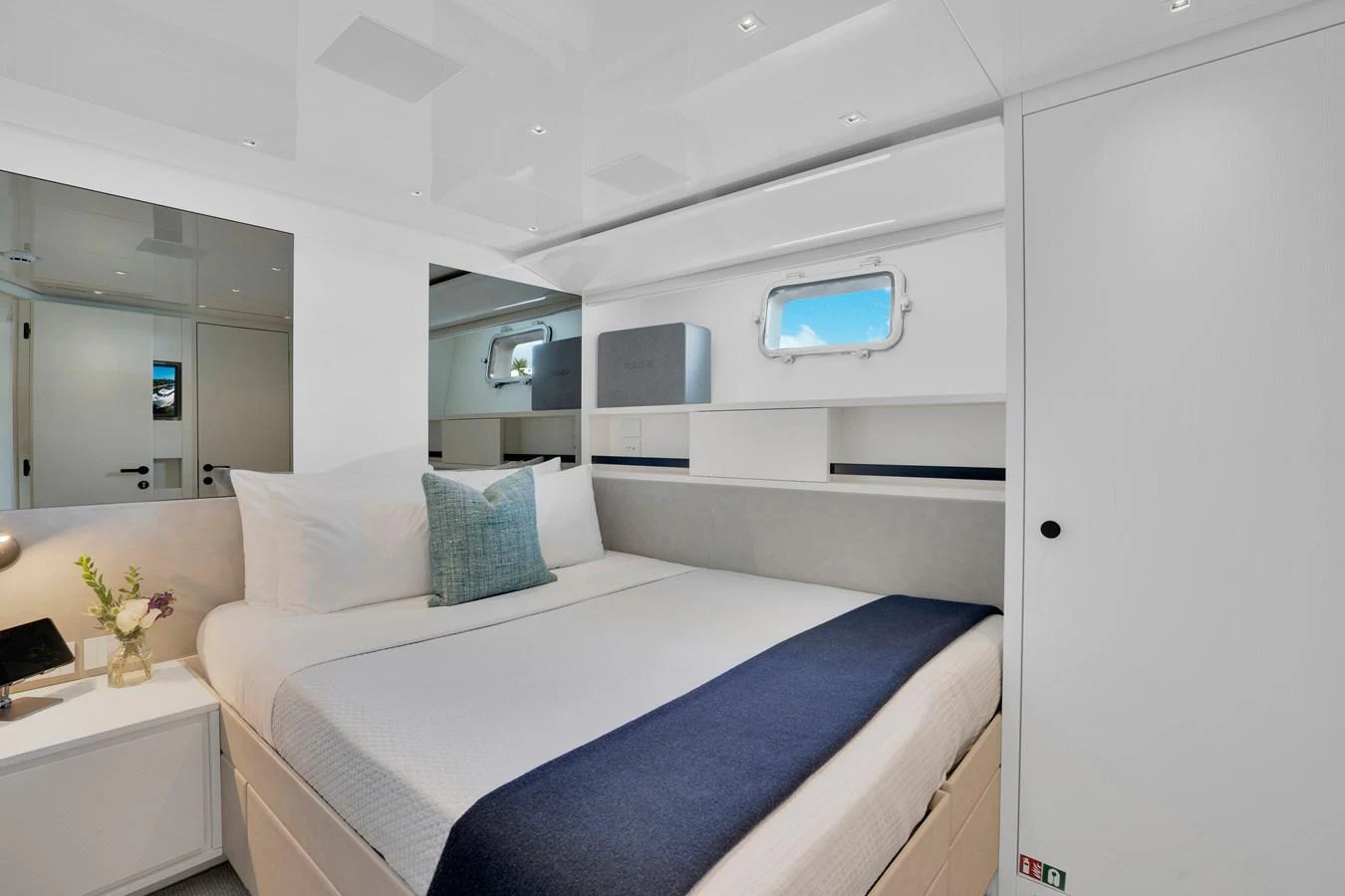 a room with a bed and a window aboard SWEET VIRGINIA Yacht for Sale