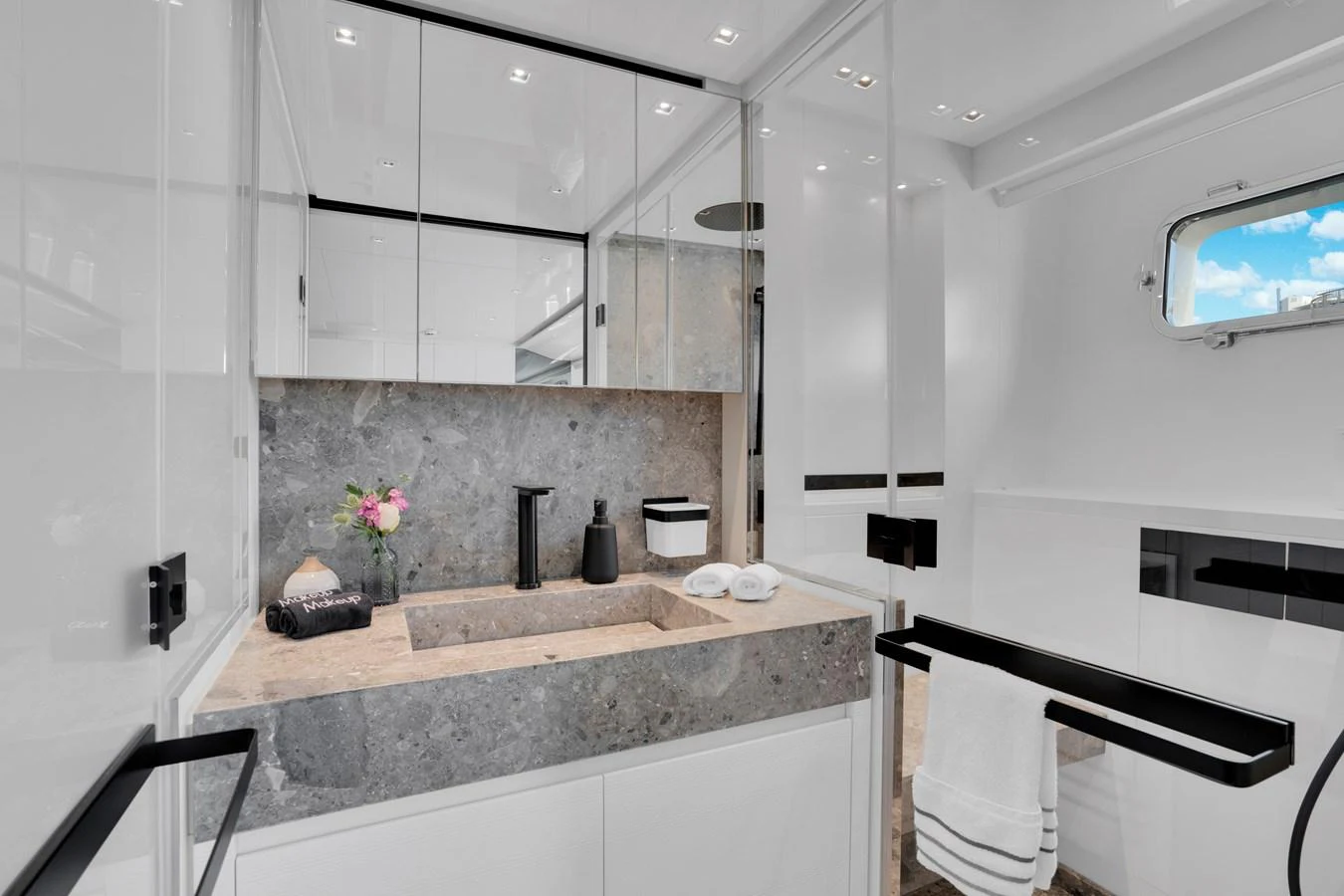 a bathroom with a sink and cabinets aboard SWEET VIRGINIA Yacht for Sale