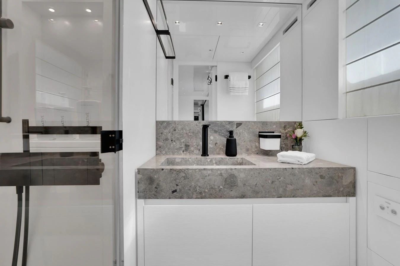 a bathroom with a sink and cabinets aboard SWEET VIRGINIA Yacht for Sale