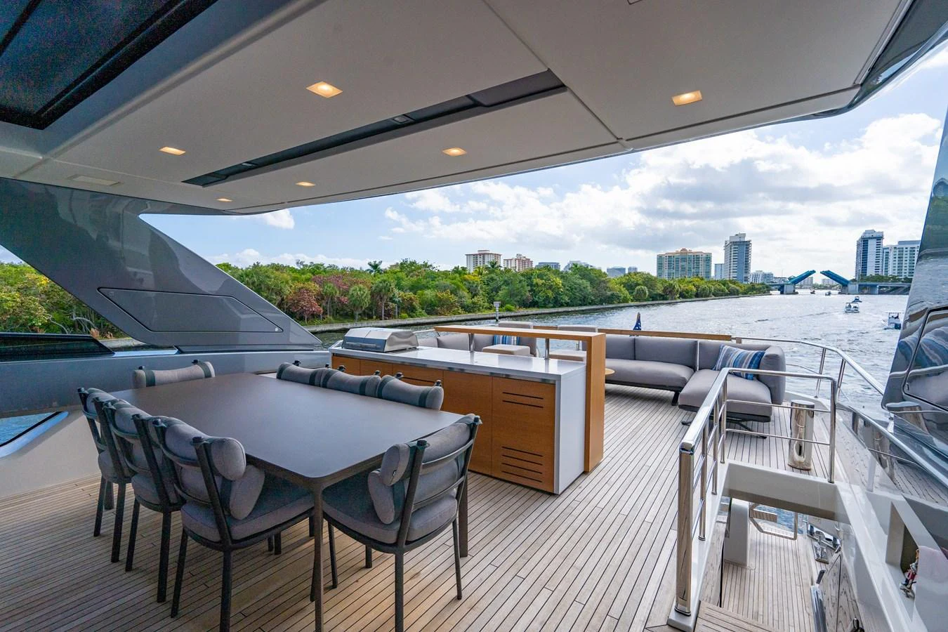a deck with a view of a city and water aboard SWEET VIRGINIA Yacht for Sale