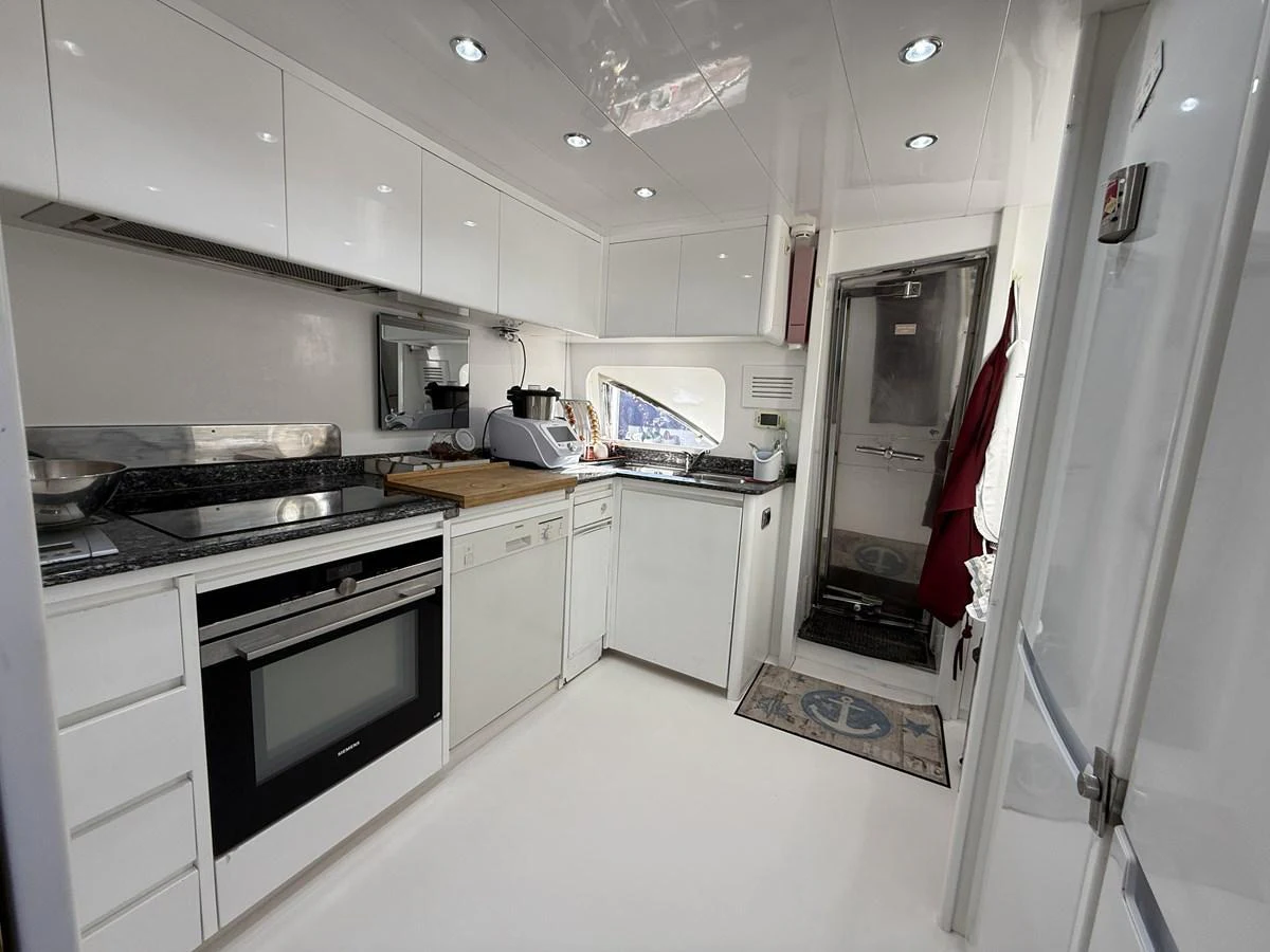 The yacht's galley is equipped with modern appliances and sleek cabinetry. aboard SIKOY Yacht for Sale