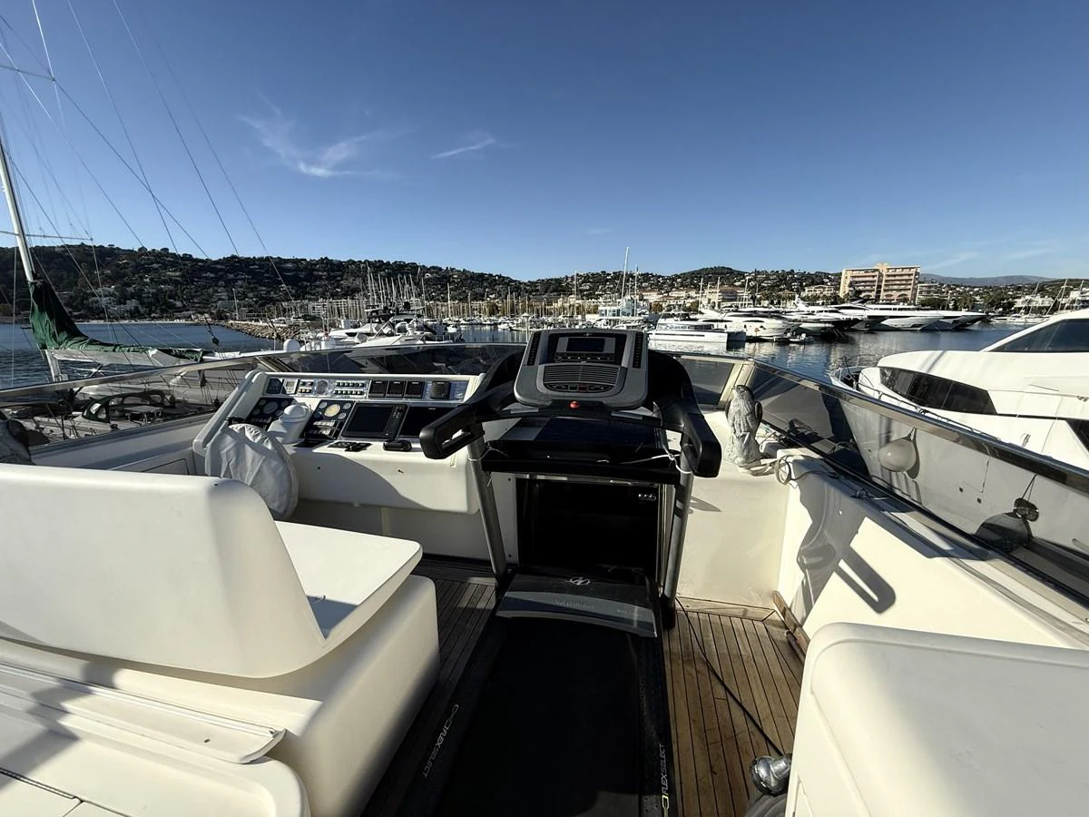 The helm station offers a commanding view of the marina, with state-of-the-art navigation equipment and comfortable seating. aboard SIKOY Yacht for Sale
