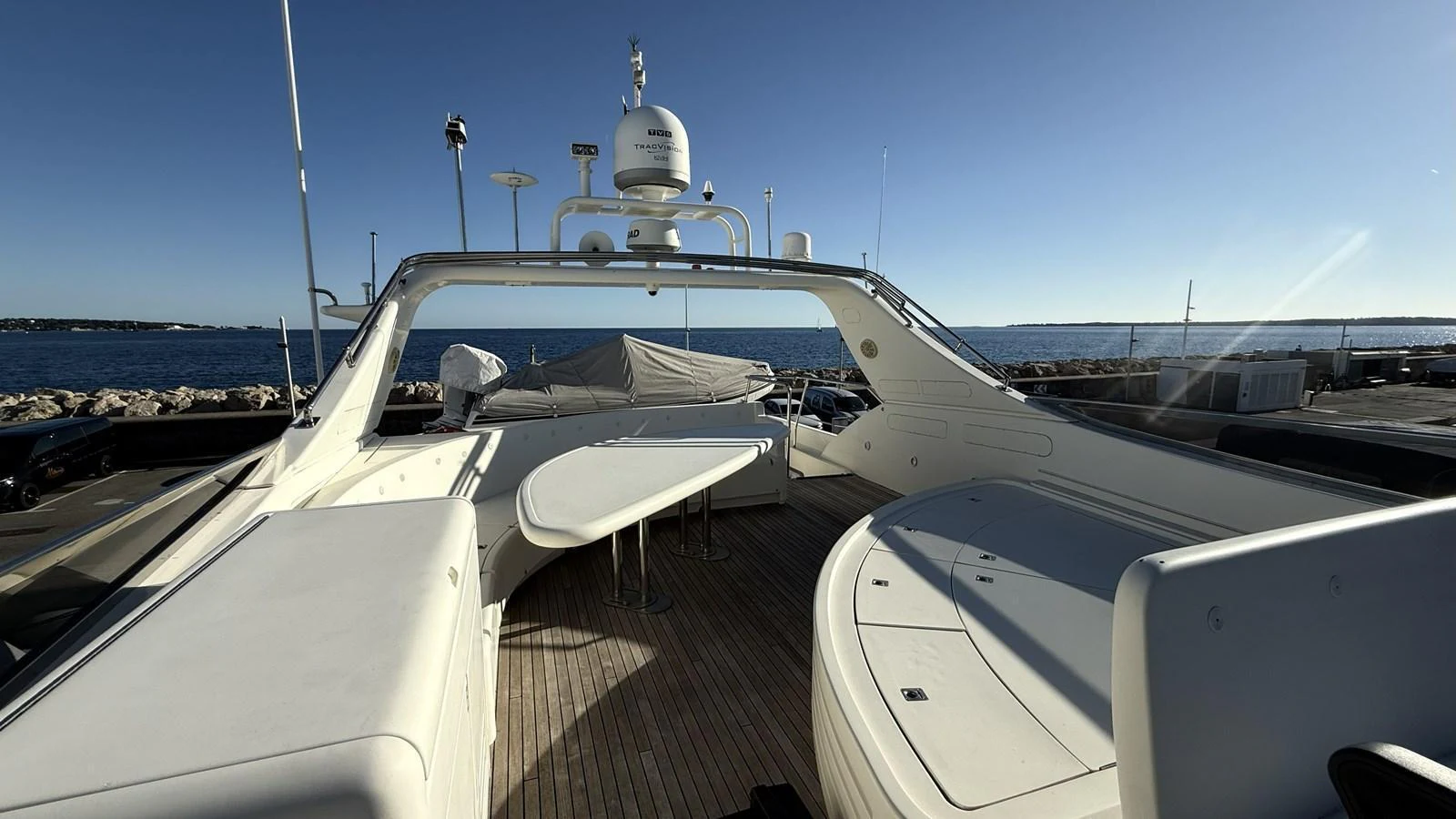 The flybridge offers a spacious and open area with ample seating and a central table, perfect for enjoying the sea views. aboard SIKOY Yacht for Sale