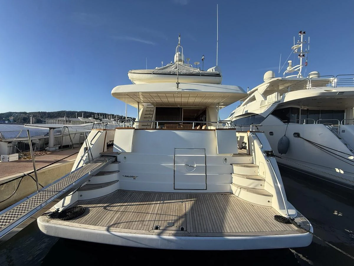 The yacht's spacious aft deck offers a welcoming area for relaxation and easy access to the water. aboard SIKOY Yacht for Sale