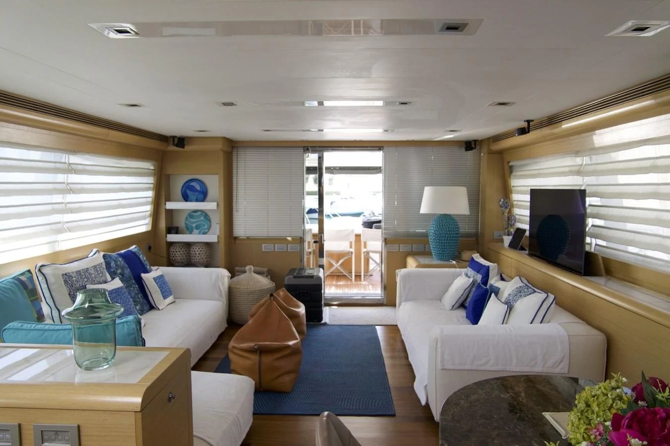a living room with a blue rug aboard ANTONINA Yacht for Sale