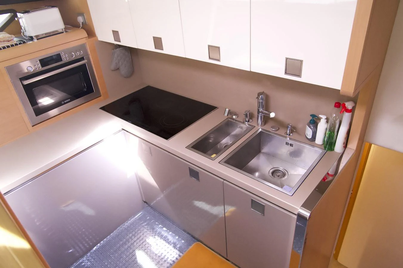 a kitchen with a sink and a microwave aboard ANTONINA Yacht for Sale