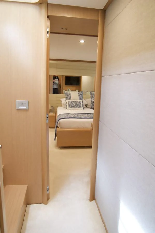 a room with a bed and a mirror aboard ANTONINA Yacht for Sale