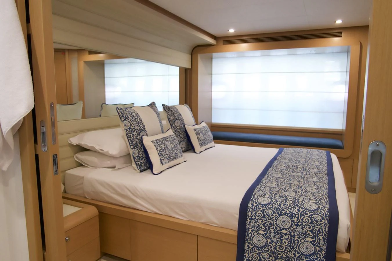 a bed with pillows and blankets aboard ANTONINA Yacht for Sale