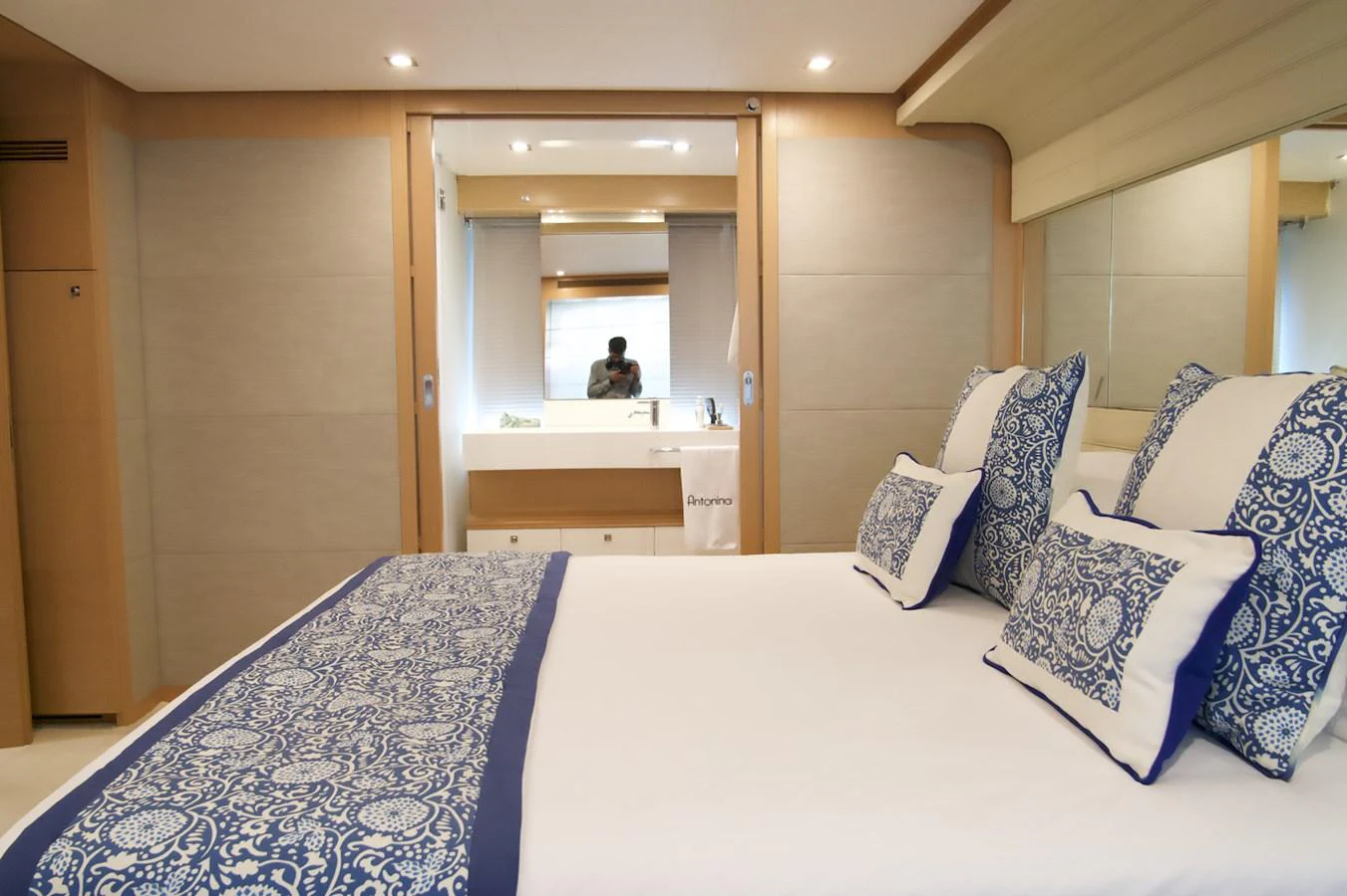 a bed with pillows and a mirror aboard ANTONINA Yacht for Sale