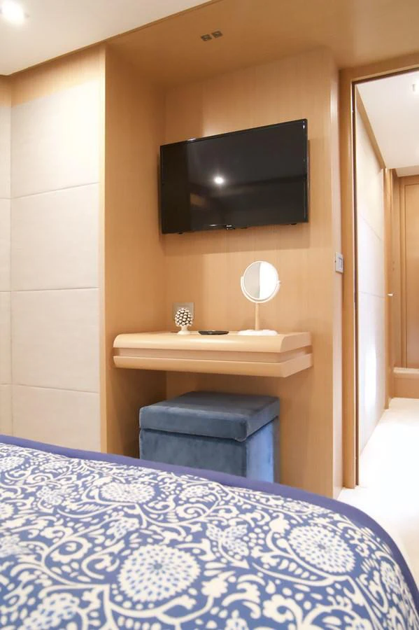 a tv on a stand in a room aboard ANTONINA Yacht for Sale