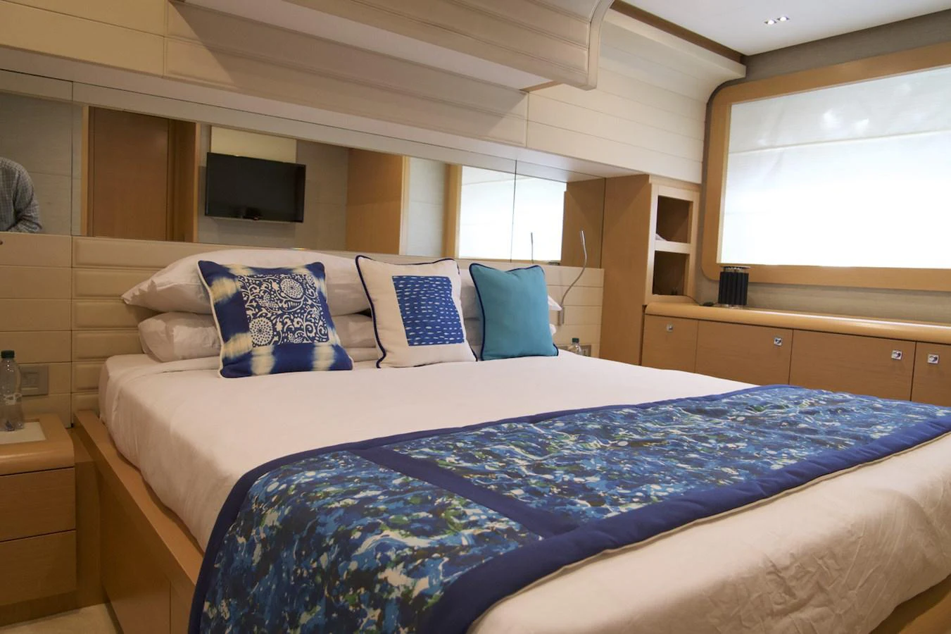 a bed with blue sheets aboard ANTONINA Yacht for Sale