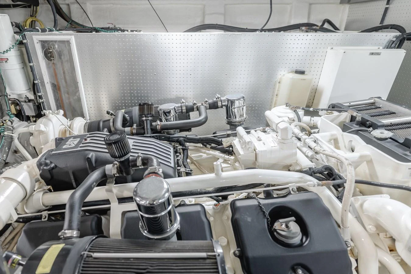 The image showcases the yacht's engine room with well-maintained machinery and components. aboard MONEY CAT Yacht for Sale