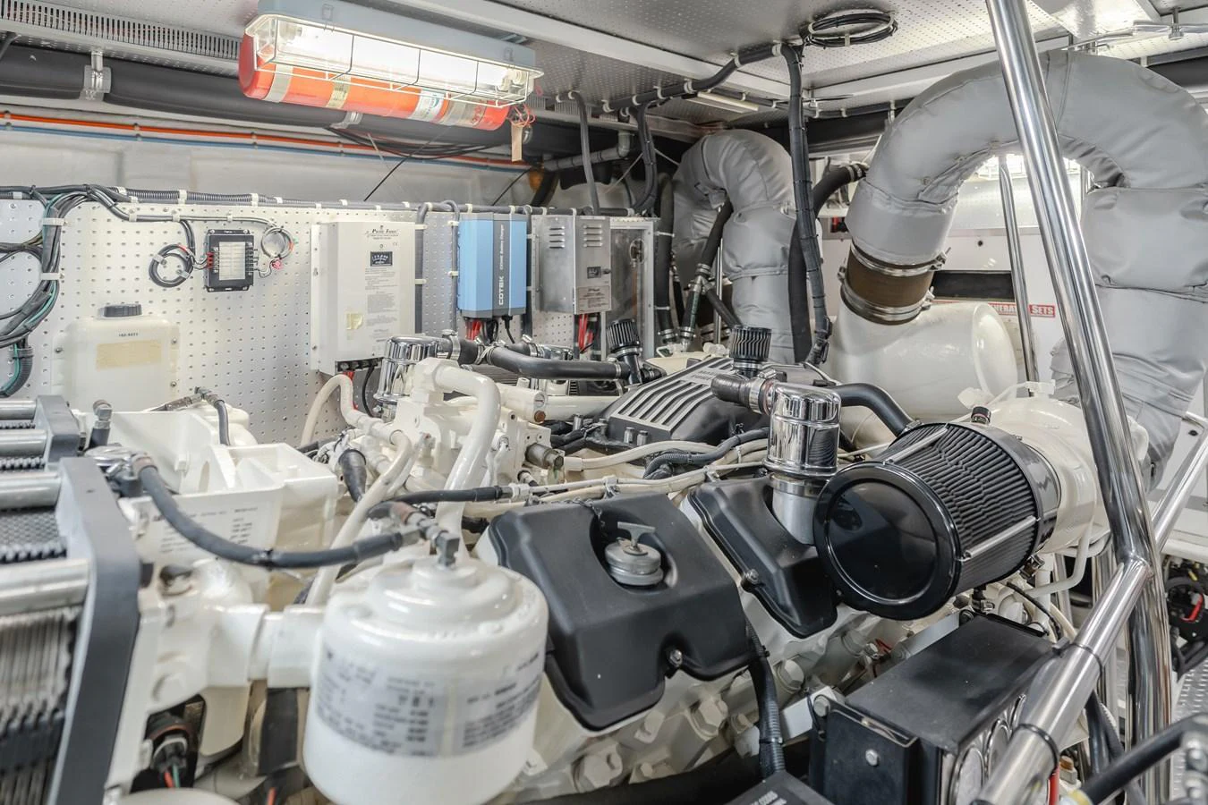 The engine room showcases the yacht's powerful and well-maintained machinery. aboard MONEY CAT Yacht for Sale