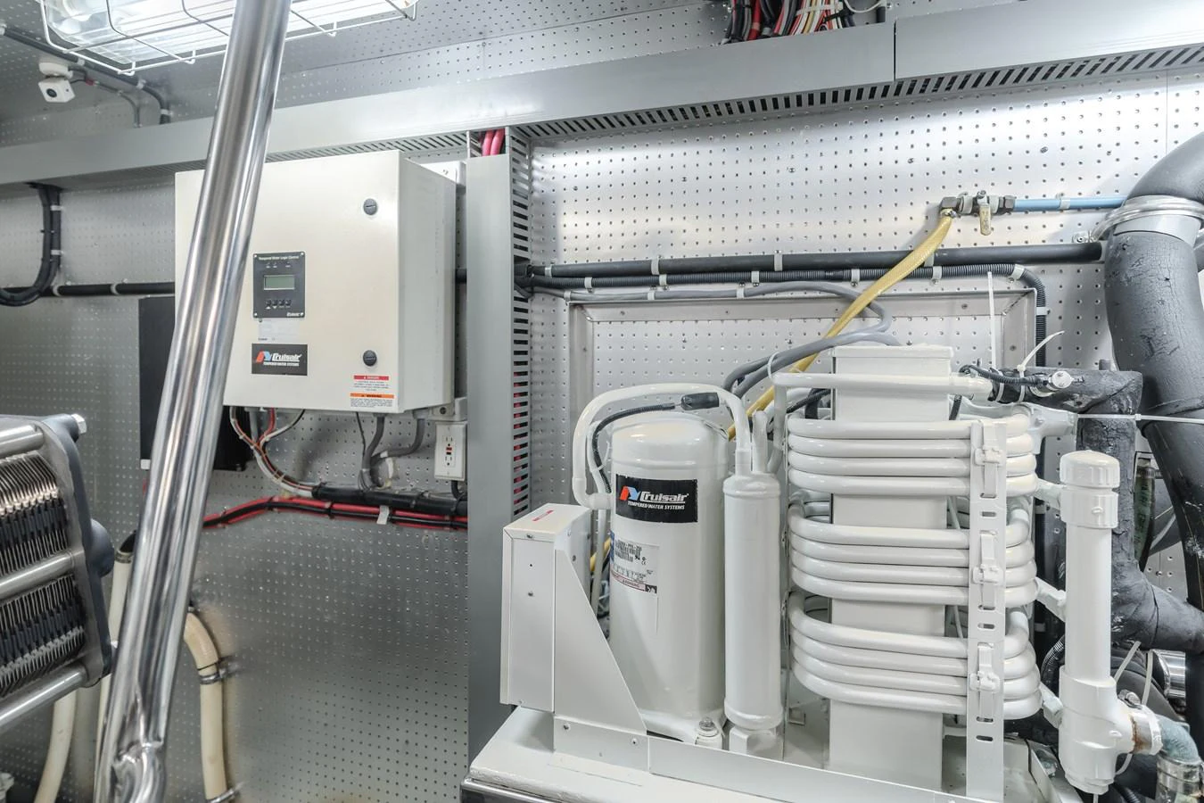 The image showcases the engine room with advanced machinery and equipment. aboard MONEY CAT Yacht for Sale