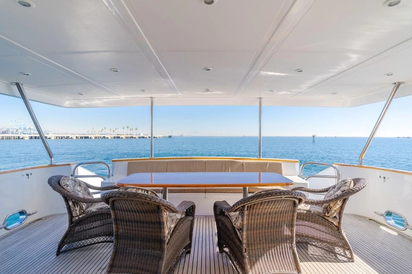 The aft deck offers a spacious and inviting area with comfortable seating and stunning ocean views. aboard MONEY CAT Yacht for Sale