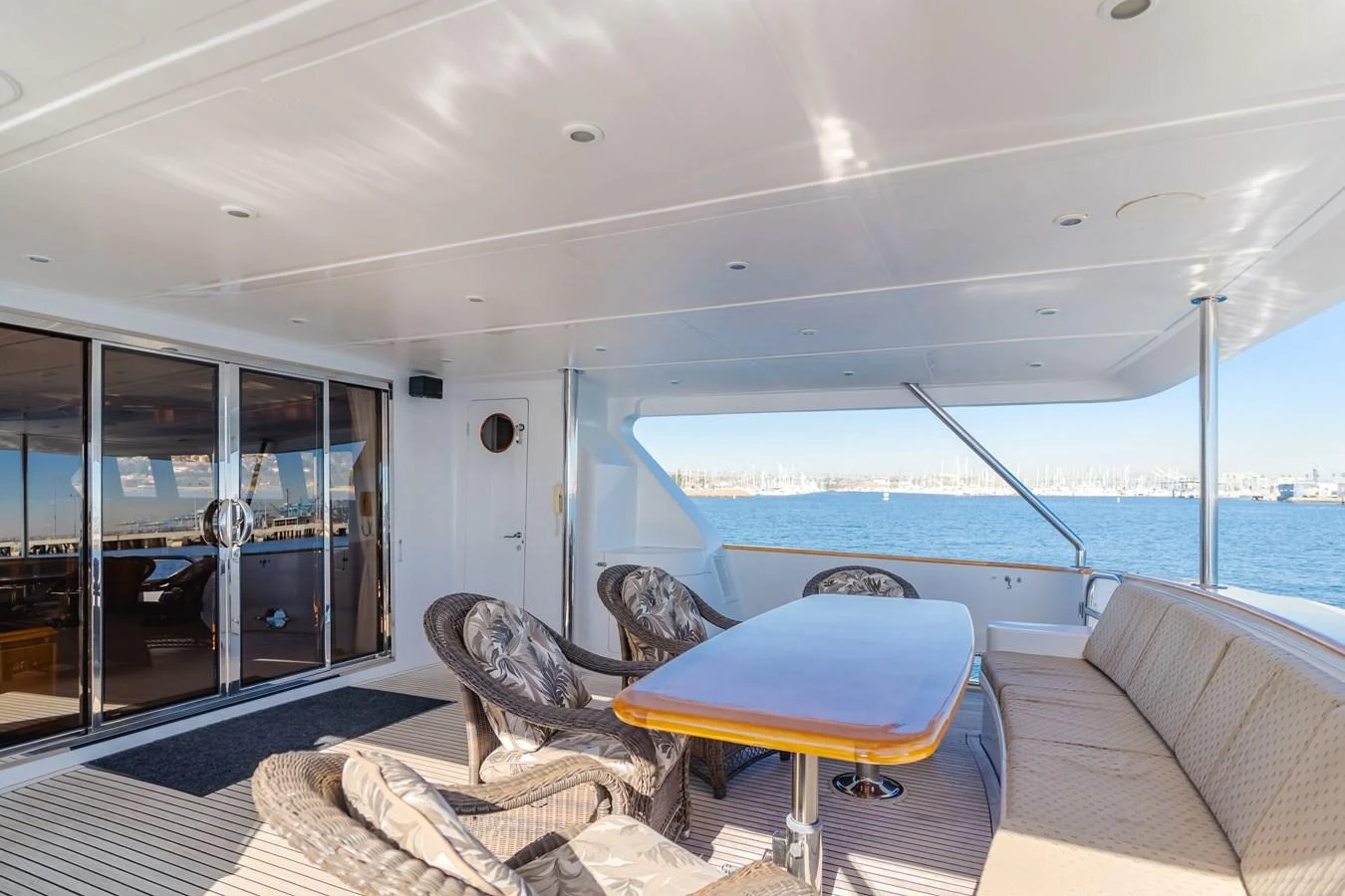 The aft deck offers a spacious and comfortable seating area with a stunning view of the water. aboard MONEY CAT Yacht for Sale