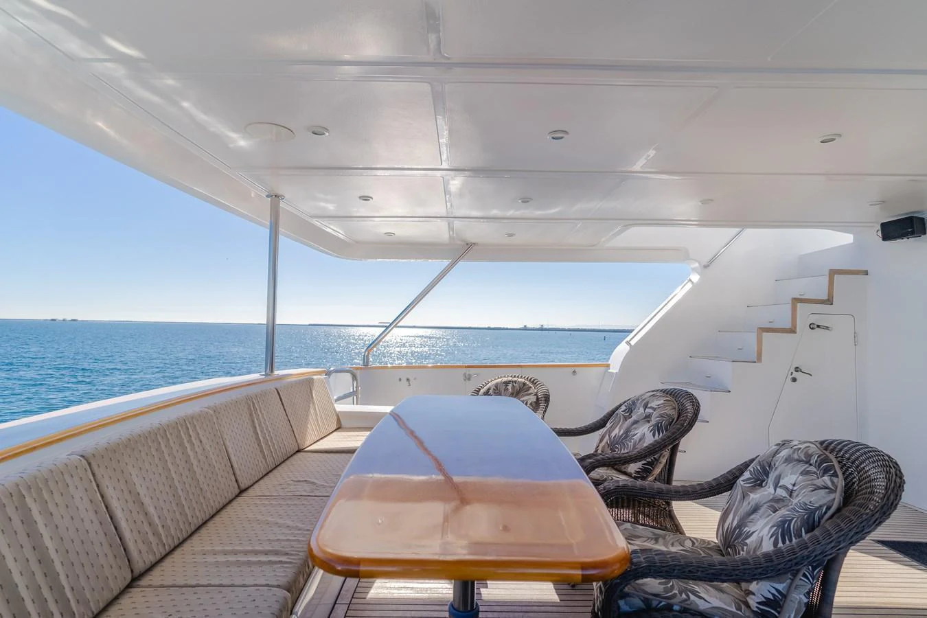 The aft deck offers a spacious and comfortable seating area with a stunning view of the sea. aboard MONEY CAT Yacht for Sale