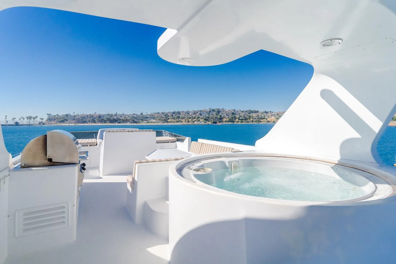 The sundeck features a luxurious hot tub with stunning views of the surrounding waters. aboard MONEY CAT Yacht for Sale