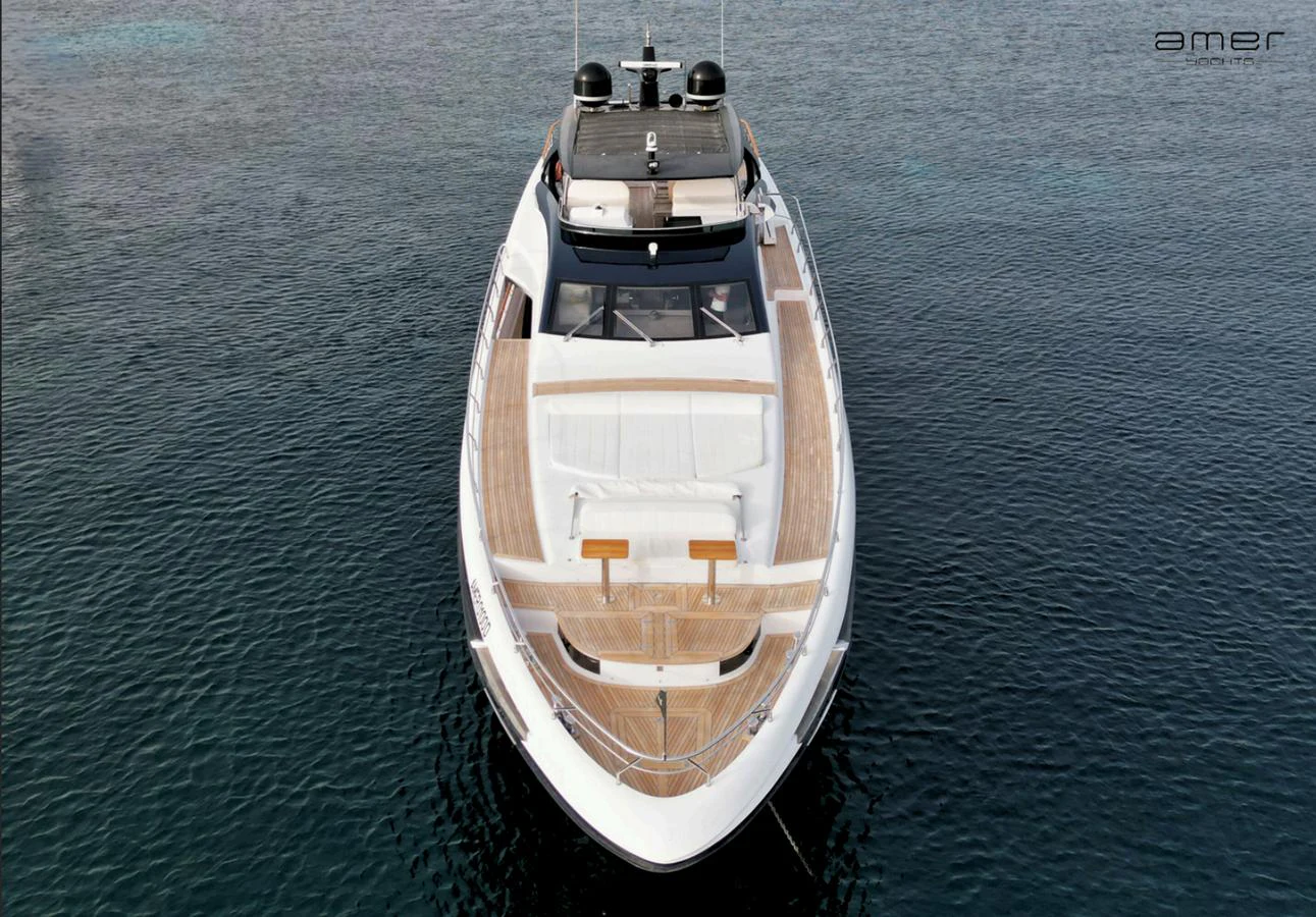 A sleek yacht with a spacious foredeck, cruising on calm waters. aboard ALTUS Yacht for Sale
