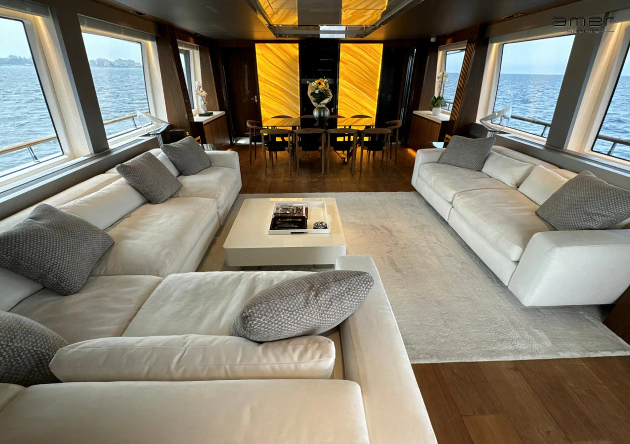 The spacious salon features luxurious seating with panoramic ocean views. aboard ALTUS Yacht for Sale