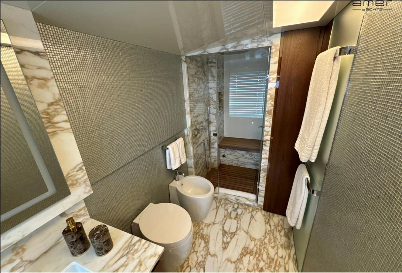The yacht's bathroom features luxurious marble finishes and modern fixtures. aboard ALTUS Yacht for Sale