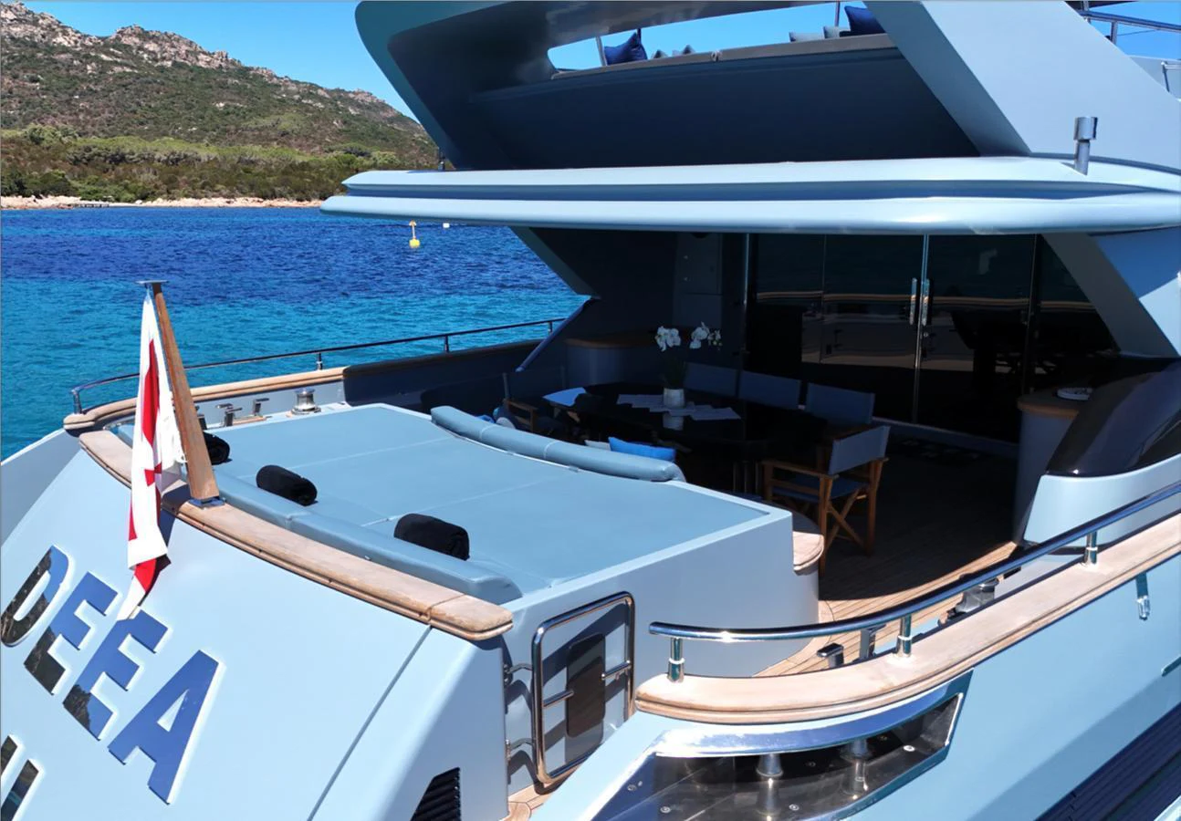 The yacht's aft deck offers a spacious and inviting area for relaxation and socializing with stunning views of the surrounding waters. aboard DEEA II Yacht for Sale