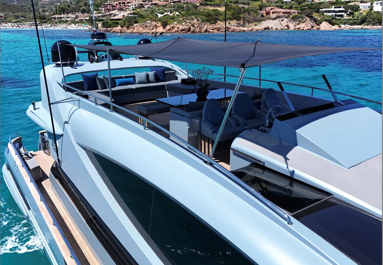 The yacht's flybridge offers a luxurious outdoor lounging area with stunning views of the turquoise waters. aboard DEEA II Yacht for Sale