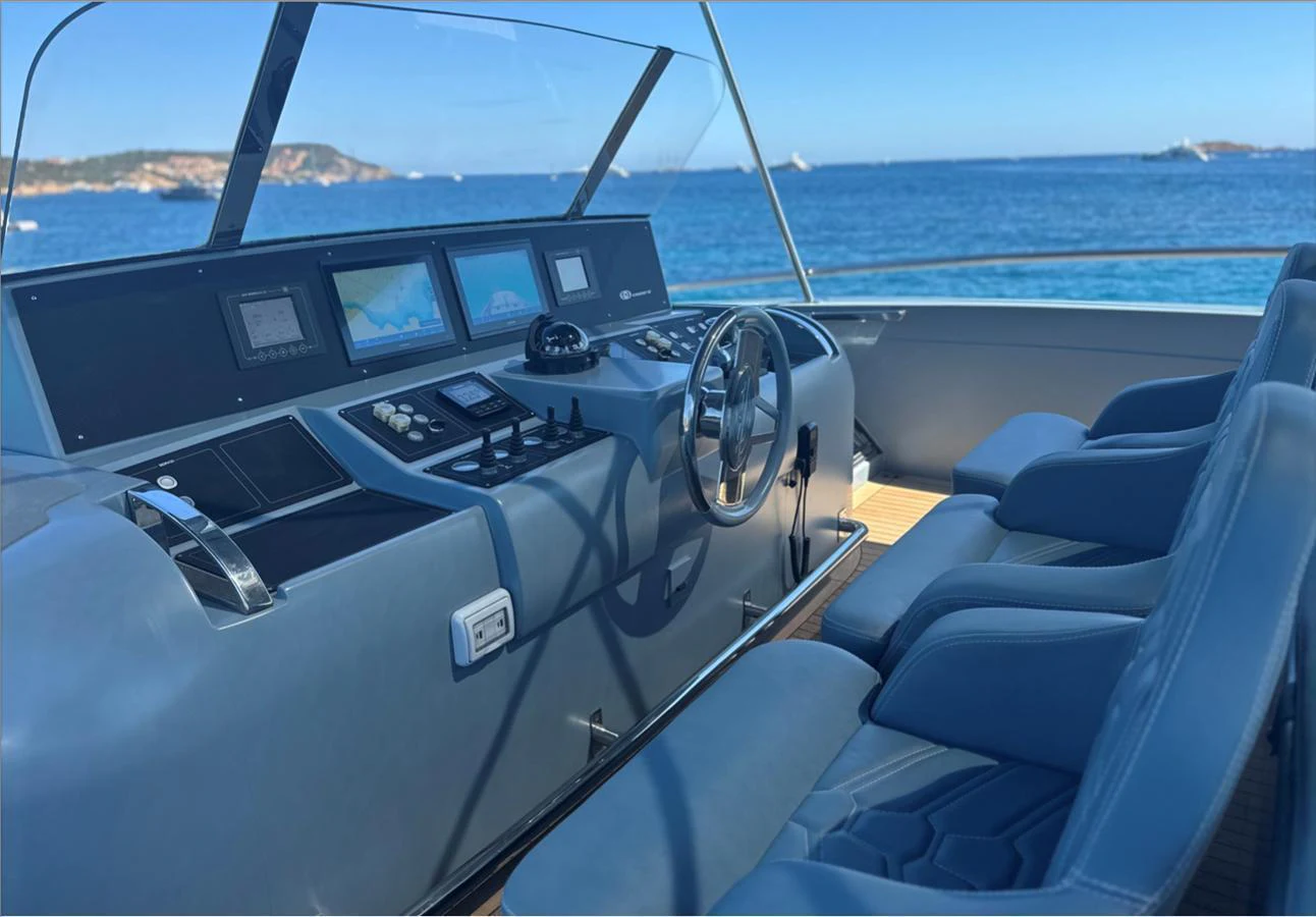 The helm station offers a commanding view with state-of-the-art navigation equipment and comfortable seating. aboard DEEA II Yacht for Sale