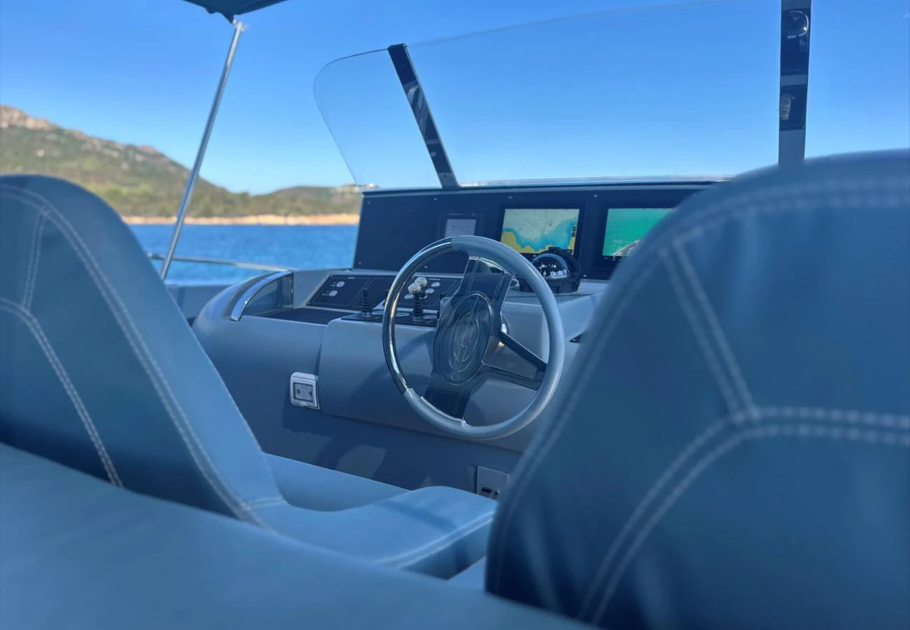 The helm station offers a modern and sleek design with advanced navigation equipment. aboard DEEA II Yacht for Sale