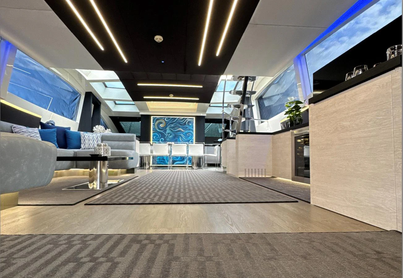 The yacht's interior features a spacious and modern lounge area with ample seating and stylish decor. aboard DEEA II Yacht for Sale