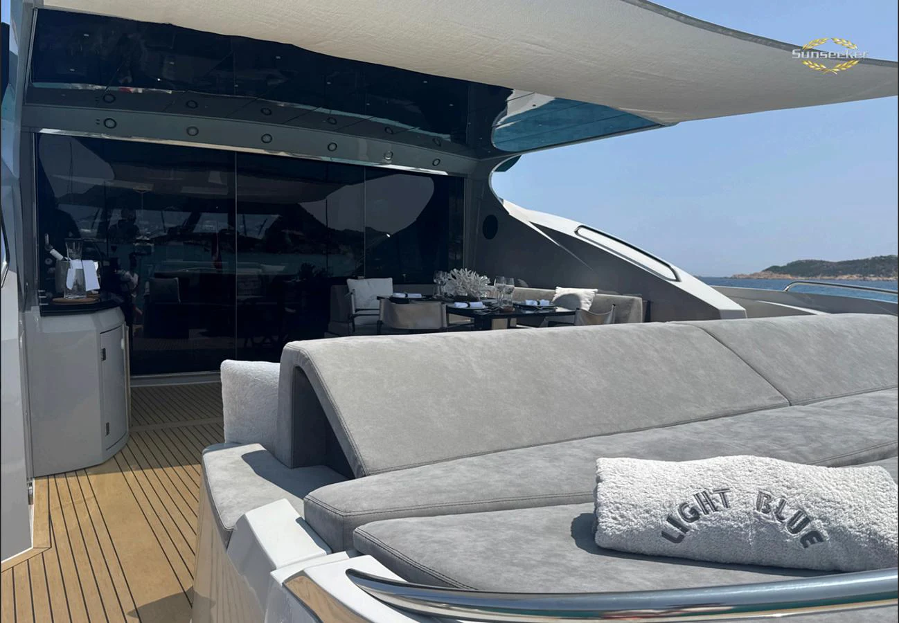 a lounge area with a large sofa aboard LIGHT BLUE Yacht for Sale