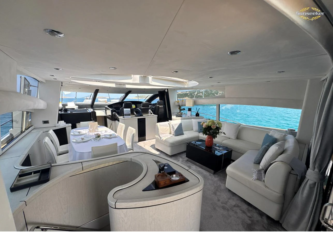 a room with a couch and a table and a pool aboard LIGHT BLUE Yacht for Sale