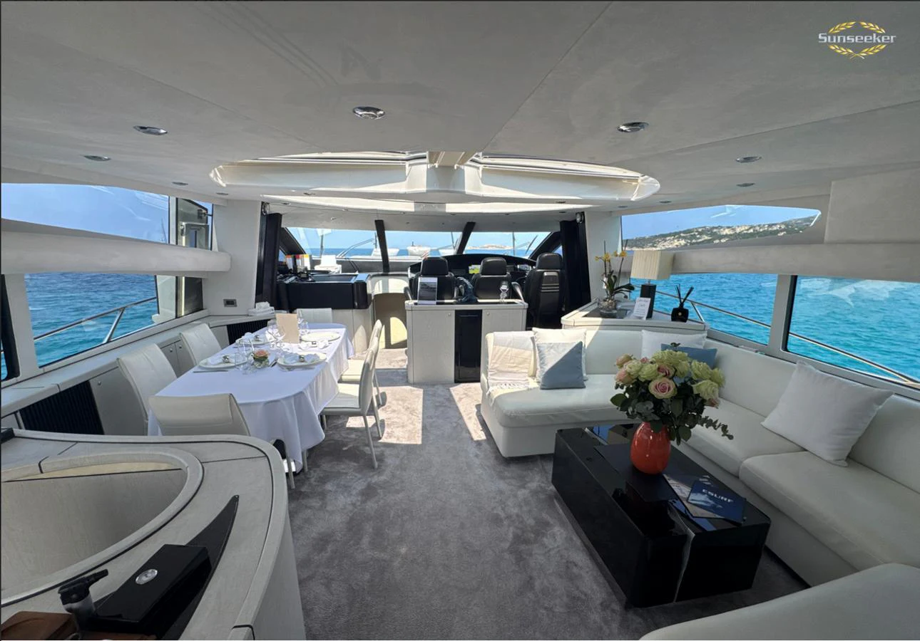 a room with a couch and a table and a window aboard LIGHT BLUE Yacht for Sale