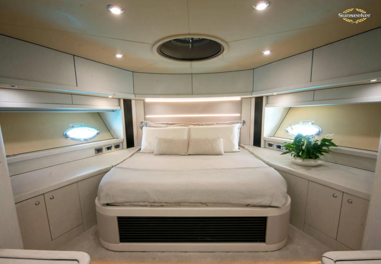 a white bed in a room aboard LIGHT BLUE Yacht for Sale
