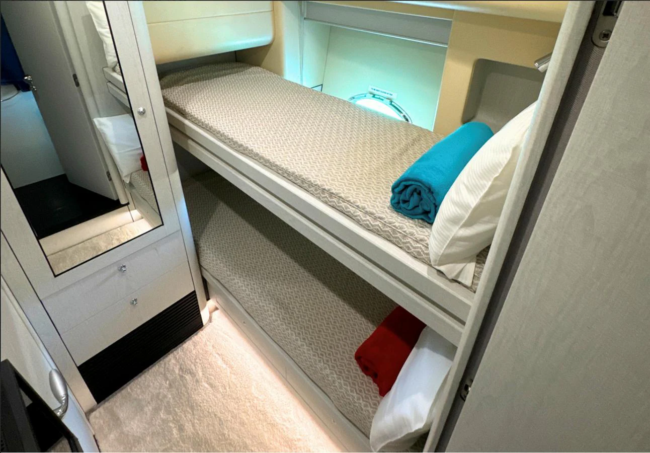 a bed in a room aboard LIGHT BLUE Yacht for Sale