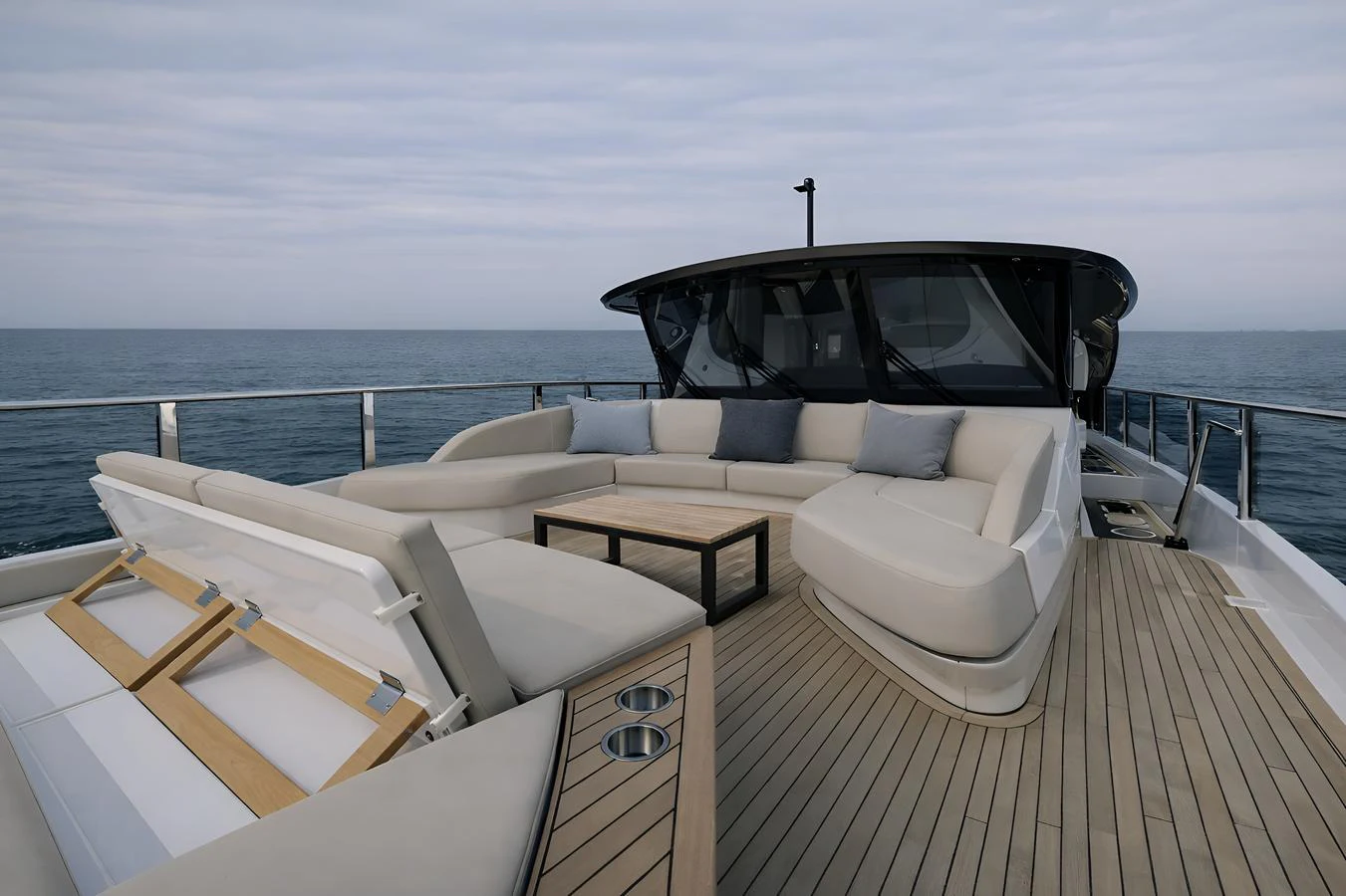 The foredeck features a spacious and luxurious lounging area with ample seating and a sleek design. aboard PRINCESS X95 808 Yacht for Sale