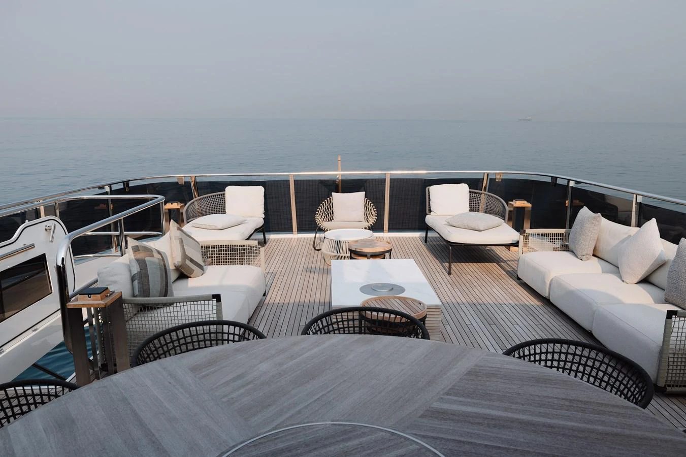 The aft deck offers a luxurious outdoor seating area with comfortable lounge chairs and a serene ocean view. aboard PRINCESS X95 808 Yacht for Sale