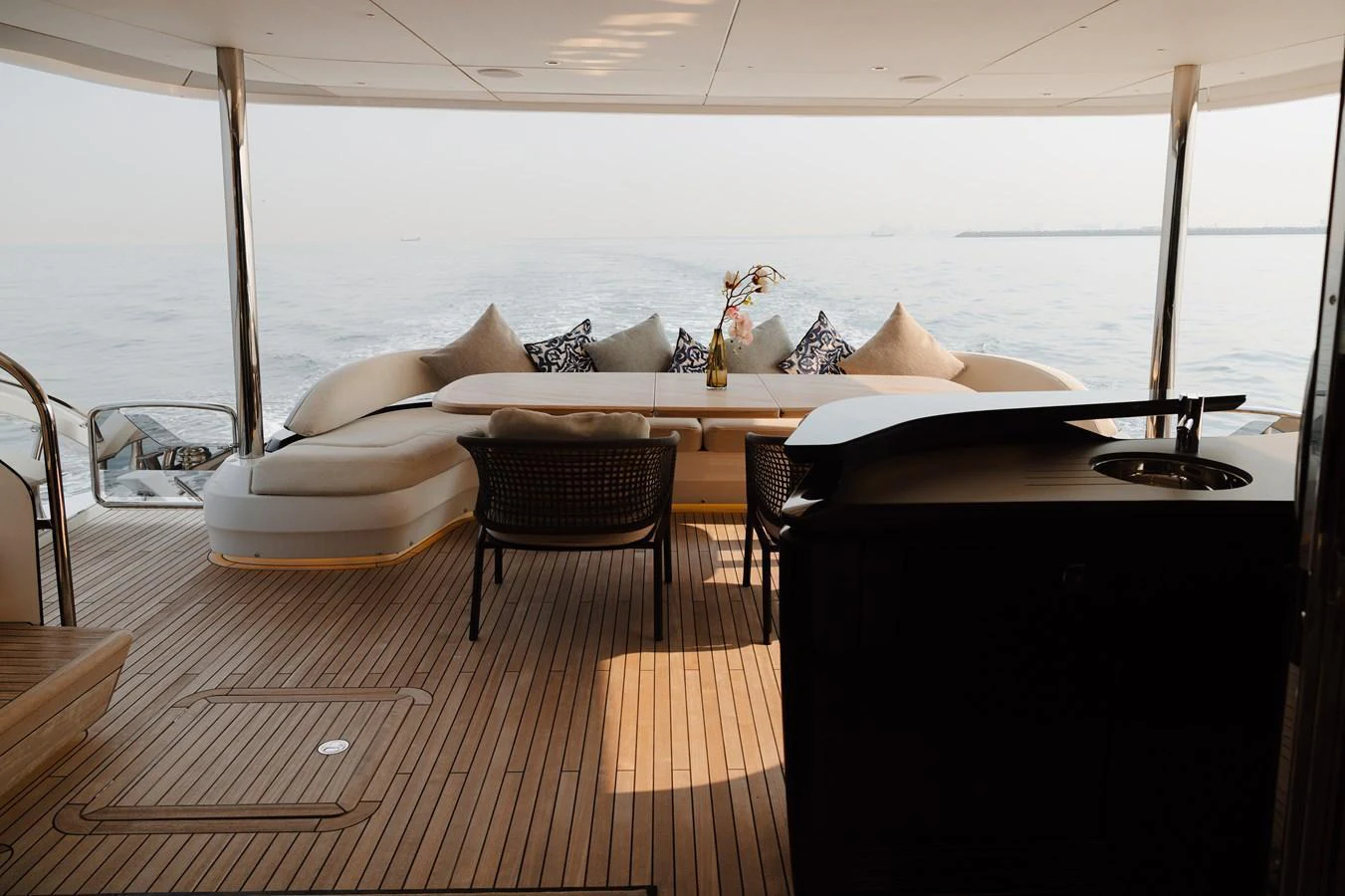 The aft deck features a comfortable seating area with a stunning view of the open water. aboard PRINCESS X95 808 Yacht for Sale
