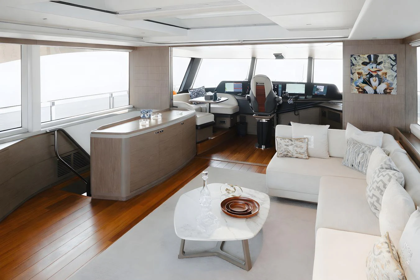 The salon features a spacious and modern design with ample seating and a sophisticated helm station. aboard PRINCESS X95 808 Yacht for Sale
