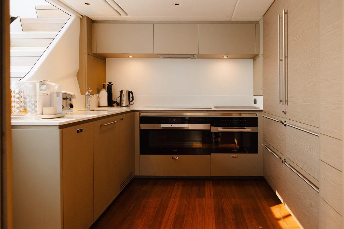 The yacht's galley features modern appliances and sleek cabinetry, creating a stylish and functional space for culinary activities. aboard PRINCESS X95 808 Yacht for Sale